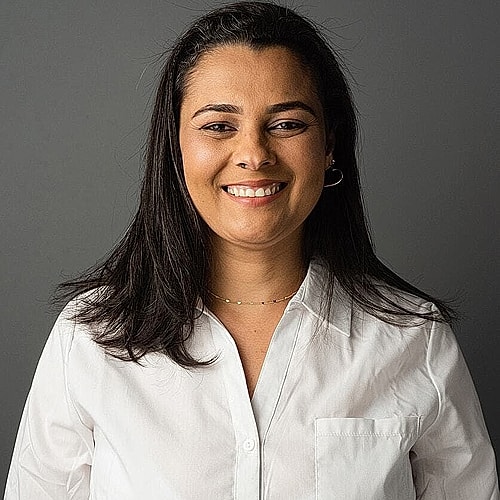 Smiling woman in a white shirt portrait.